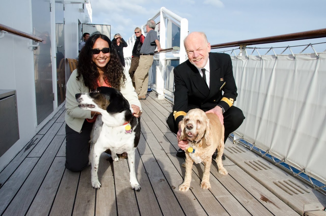 Chewy and Abby and the captain on the QM2