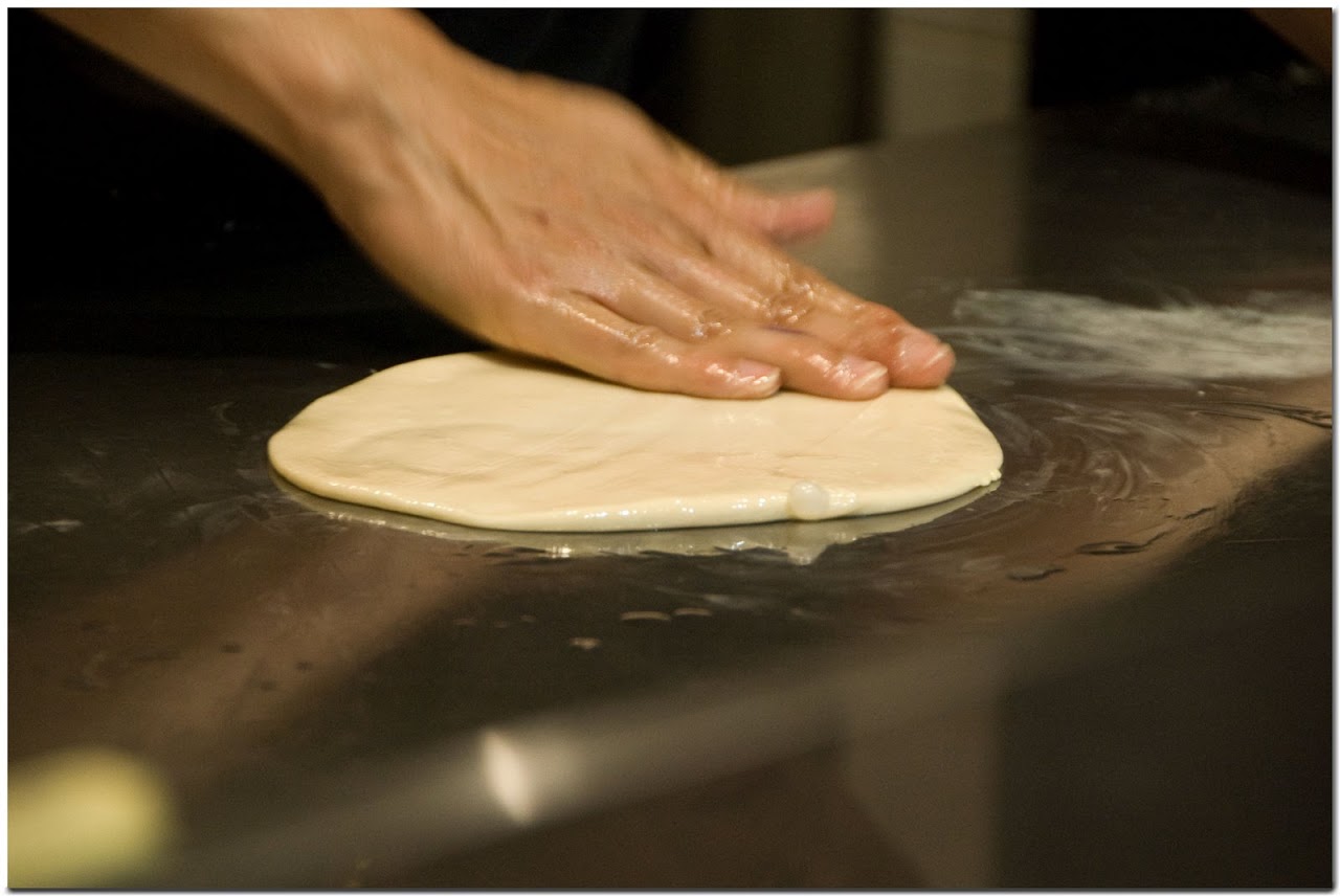 Flattening roti dough